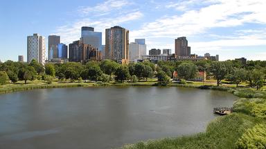 Small lake with Minneapolis high rises in the background