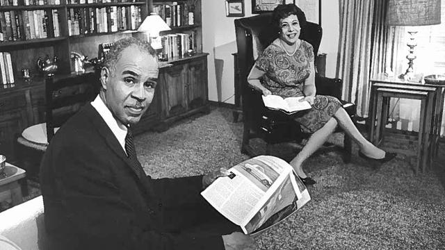 Roy Wilkins and his wife Aminda sitting in the library at their home. 
