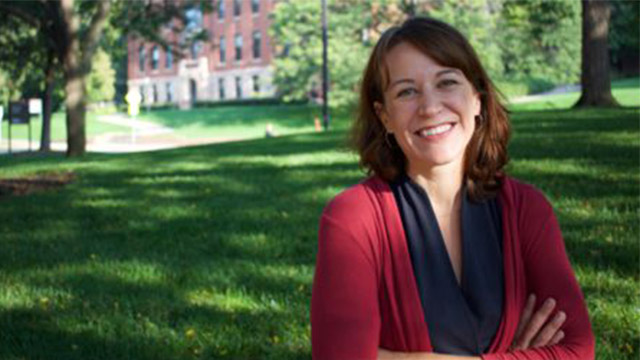 Headshot of Prof. Bonnie Keeler with a grassy lawn in the background