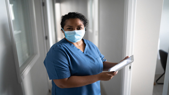 Female health care worker with mask