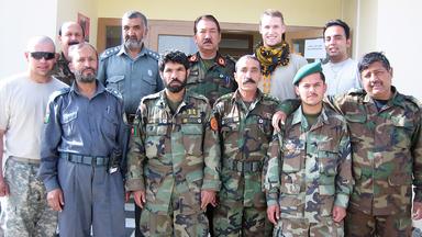 Andrew Jaunich in a group photo of American and Afghani service members