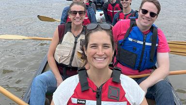 Researchers in a canoe on the Mississippi River