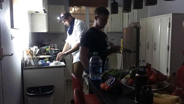 Cooking by headlamp during a power outage in Puerto Rico