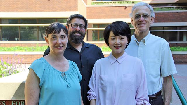 PhD candidate Chen Zhang with three faculty members