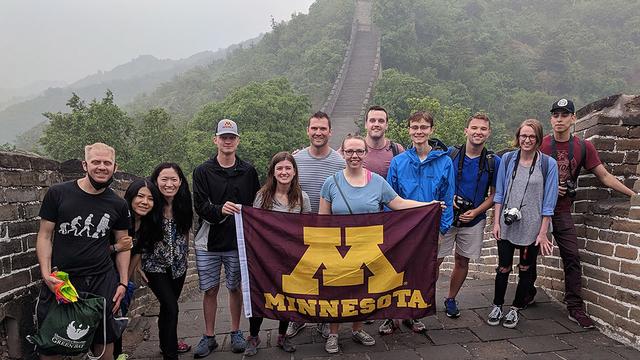 A group of UMN students standing on the Great Wall of China 