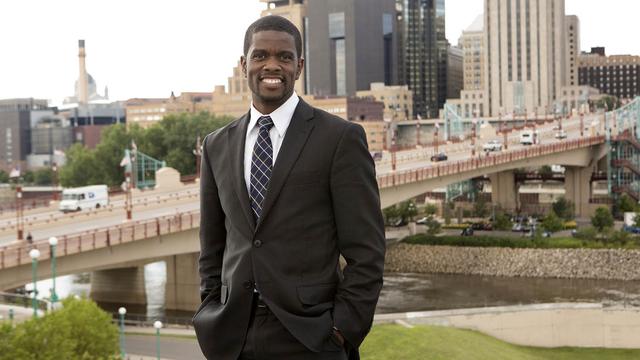 Portrait of St. Paul Mayor Melvin Carter, with downtown St. Paul in the background