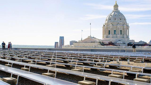 Solar panels with the Minnesota State Capitol building in the background