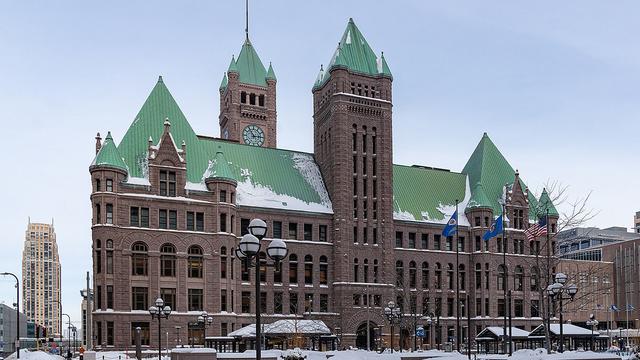 The exterior of Minneapolis City Hall with snow on the ground