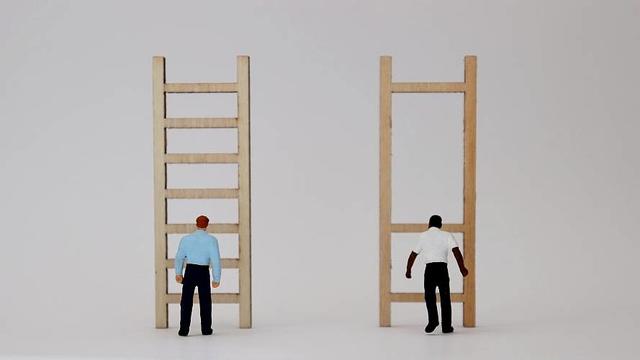 Graphic of two people standing in front of ladders, representing structural racism 