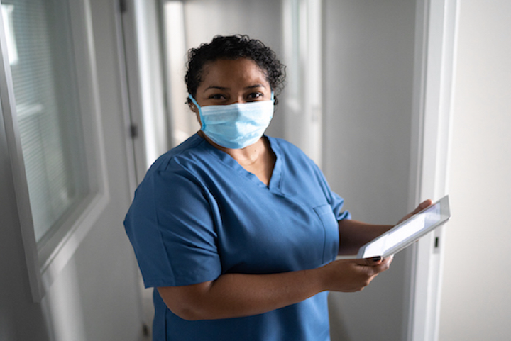 Female healthcare worker wearing a medical mask