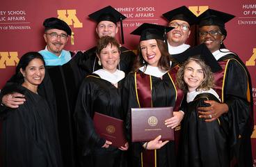 Group photo of Kevin Gerdes and MPA graduates at 2023 commencement
