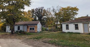 Two houses side by side in a state of disrepair